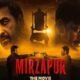 मिर्जापुर द मूवी, Mirzapur The Movie, Mirzapur Movie Trailer, Mirzapur Trailer, पंकज त्रिपाठी, अली फजल, दिव्येंदु, रवि किशन, कालीन भैया, गुड्डू पंडित, मुन्ना त्रिपाठी, Mirzapur Movie Release Date, Mirzapur 2026, Gurmeet Singh, Puneet Krishna, Farhan Akhtar, Ritesh Sidhwani, Bollywood News